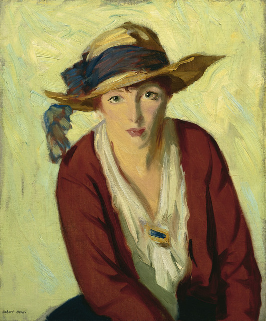 A painting of a young, red-headed woman dressed in a white blouse with a red cardigan. The background is painted with hues of yellow, green, and blue using wide brush strokes. 