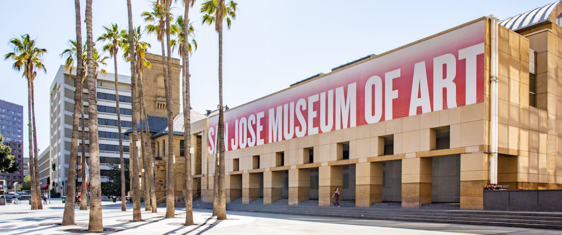 exterior of museum with palm trees